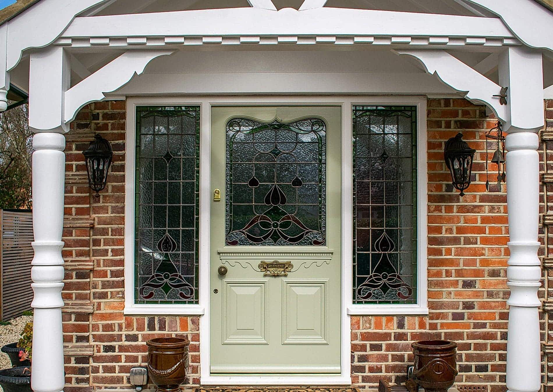 bespoke Edwardian front door with stained glass. Antique brass door furniture