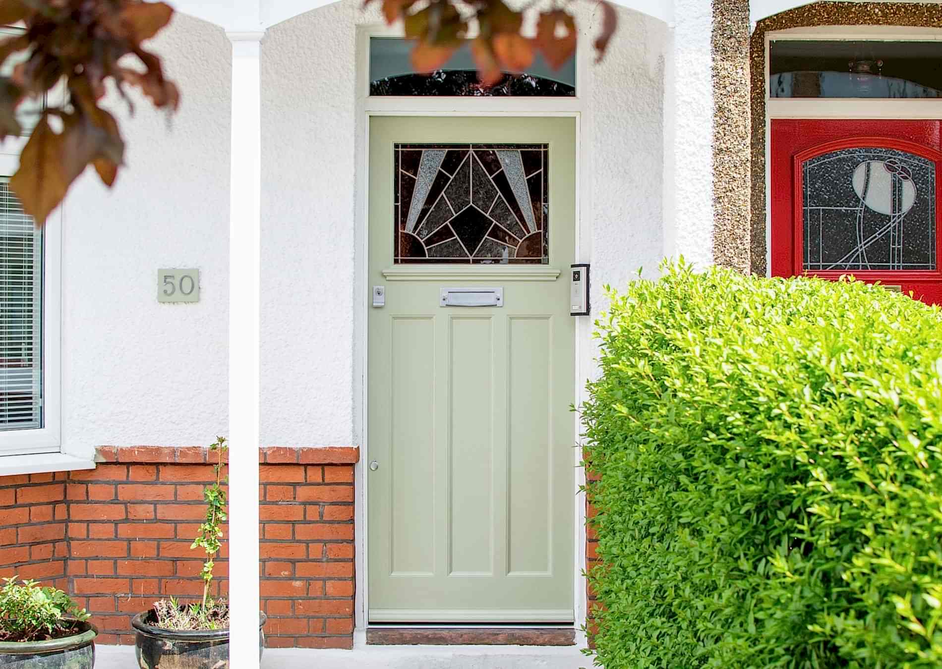 1930s front door with stained glass. door fully painted. Satin chrome door furniture